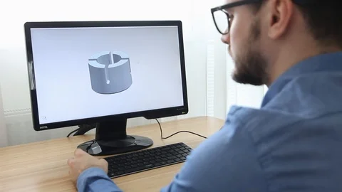 Constructor Creating a New 3D Model of Mechanical Component in CAD App Stock Footage 106031766