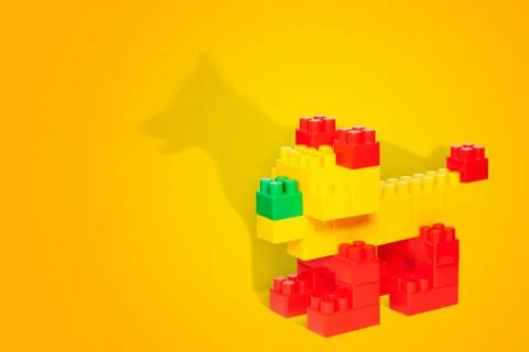 Constructor toy dog with a shadow of a real dog Stock Photos