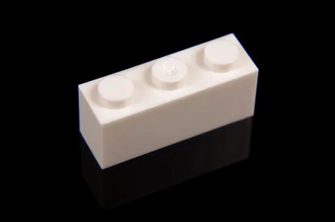 Constructor toy plastic brick close up isolated on the black Stock Photos