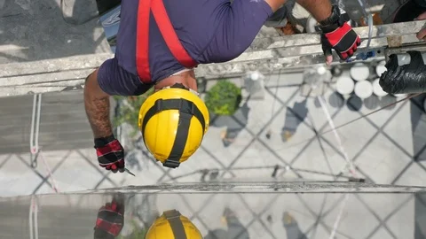 Constructor worker on scaffolding install window film Vidéo 80554401