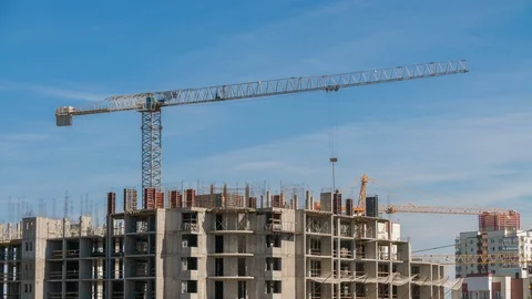 Constructors work at construction site residential, tower crane elevate weight Vídeos de archivo 114829733