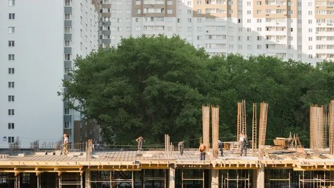 Constructors work with steel rebar and concrete on construction site residential Vídeos de archivo 114829500