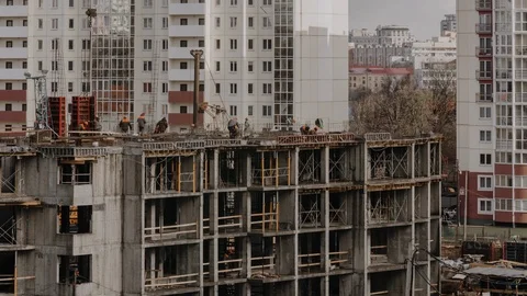 Constructors working at construction site residential estate building in city Stock Footage 104522082