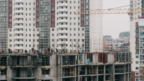 Constructors working at construction site residential estate building in city Stock Footage 105186725