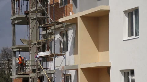 Construstion. Worker corrects crane moves. Stock Footage 53824829