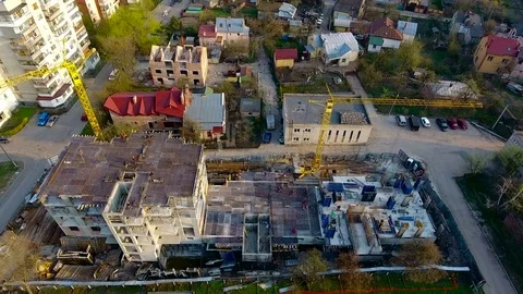 Constuction crane on buildings with builders Stock Footage 74128564