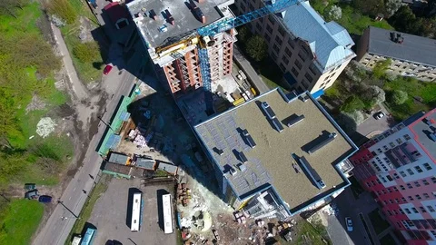 Constuction crane on buildings with builders Stock Footage 74365172