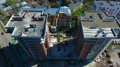 Constuction crane on buildings with builders Stock Footage 74365844
