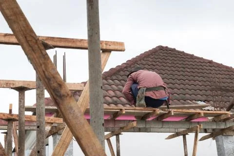 Constuction site with back of worker Stock Photos