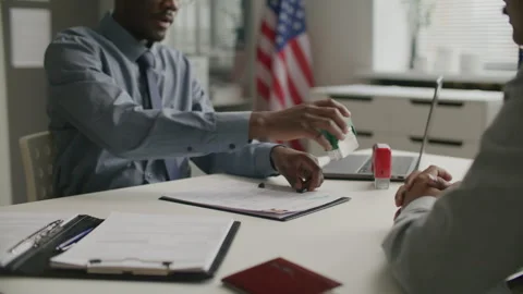 Consular Officer Shaking Hands with Applicant after Visa Approval Stock Footage 304276121