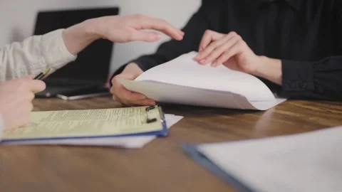Consultation and signing of the contract, documents. no face Stock Footage 219206327
