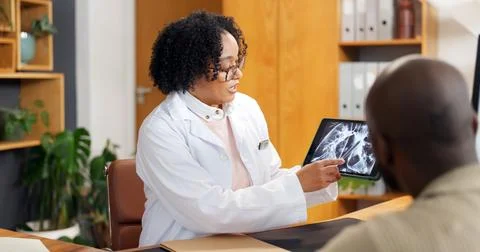 Consulting, tablet screen and xray with doctor of patient in office for feedback Stock Photos