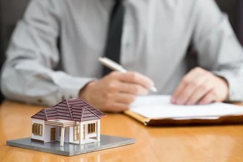 Consumer fill in the home loan application form for pending approval from the Stock Photos