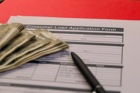 Consumer loan application process with cash in view Stock Photos