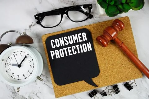 Consumer Protection text on speech bubble with alarm clock and wooden gavel.. Stock Photos