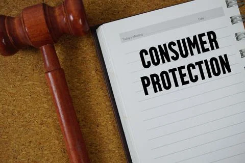 Consumer Protection text written on notebook paper with Judges Gavel 스톡 사진
