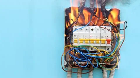 Consumer unit burned down, outdated electrical wiring is fire hazard. Stock Photos