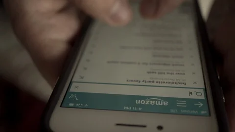 Consumer using smartphone to search for product on Amazon marketplace app Stock Footage 106486038
