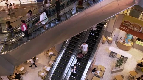 Consumerism and Lifestyle: Crowds Navigating Shopping Mall - Hong Kong Stock-Footage 249710004