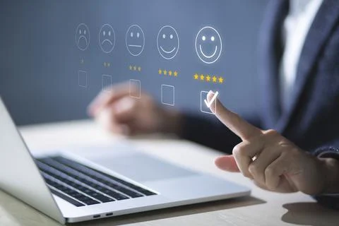 Consumers are evaluating their satisfaction with the service. Consumers write Stock Photos