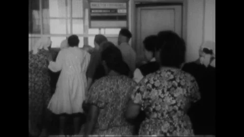 Consumers stand in a long queue to get sugar or flour - 1955 Stock Footage 105498178