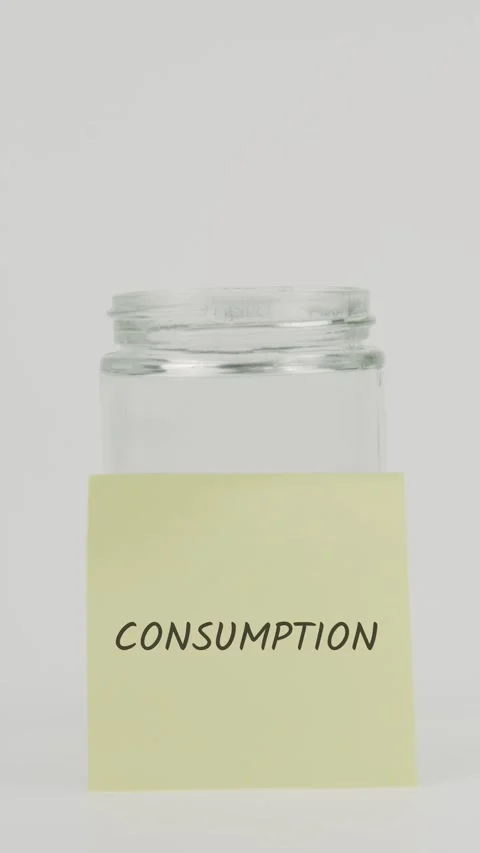 Consumption text or word on yellow sticky note attached to glass jar Stock Footage 311697591