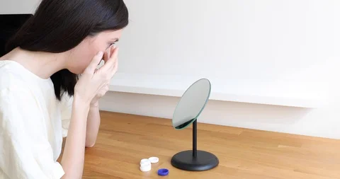 Contact lens removal process after use during the day. Stock Footage 128134591