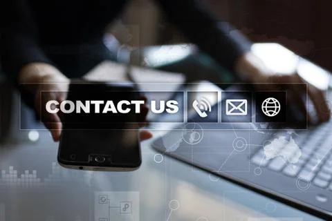 Contact us button and text on virtual screen. Business and technology concept. Stock Photos