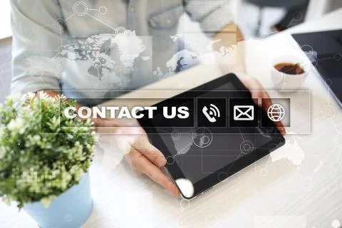 Contact us button and text on virtual screen. Business and technology concept. Stockfoto's