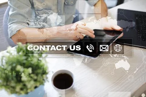 Contact us button and text on virtual screen. Business and technology concept. Stock-Fotos