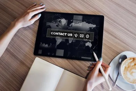 Contact us field and button on screen. Business concept. Stock Photos