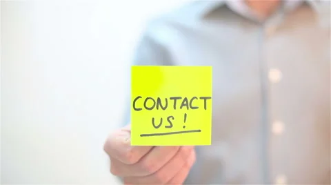 Contact Us. A man sticks a note on transparent screen Stock Footage 68088613