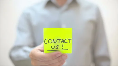 Contact Us. A man sticks a note on transparent screen Stock Footage 68088750
