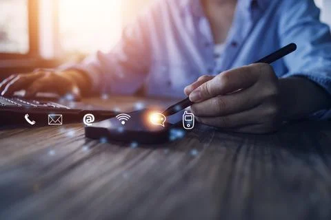 Contact us or Customer support hotline people connect. Businessman using a .. Stock Photos