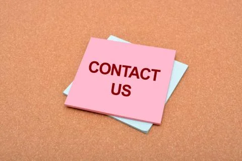 Contact Us written on notepad with background texture Stock Photos