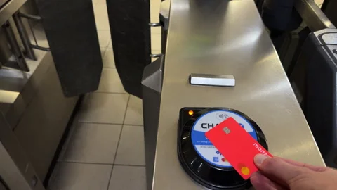 Contactless card payment at transit turnstile in Hans Town, England Stock Footage 336671679