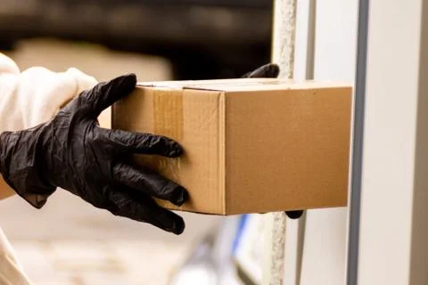 Contactless delivery concept. Delivery service during quarantine pandemic cor Stock Photos