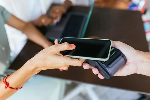 Contactless Payment in Action: Utilizing Mobile Phone for a Seamless Transaction Stock Photos