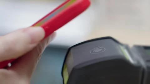 Contactless payment. Paying for a purchase with a smartphone using a contactless Stock Footage 319841092