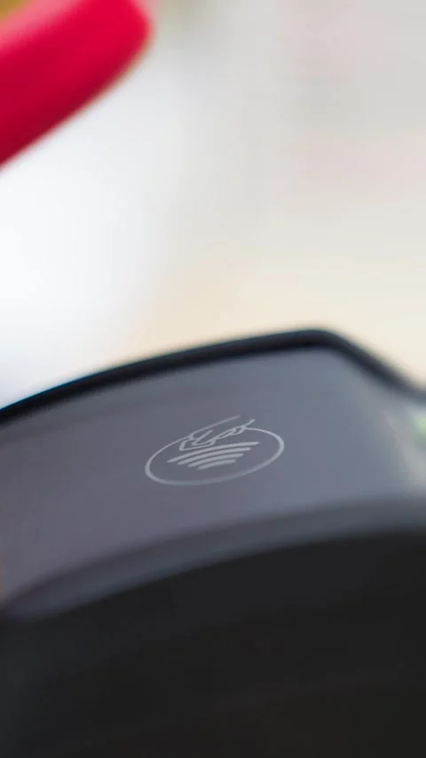 Contactless payment. Paying for a purchase with a smartphone using a contactless Stock Footage 319843394