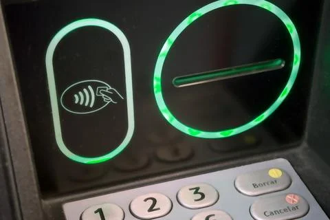 Contactless payment reader and ATM keypad for secure banking and cash access Stock Photos