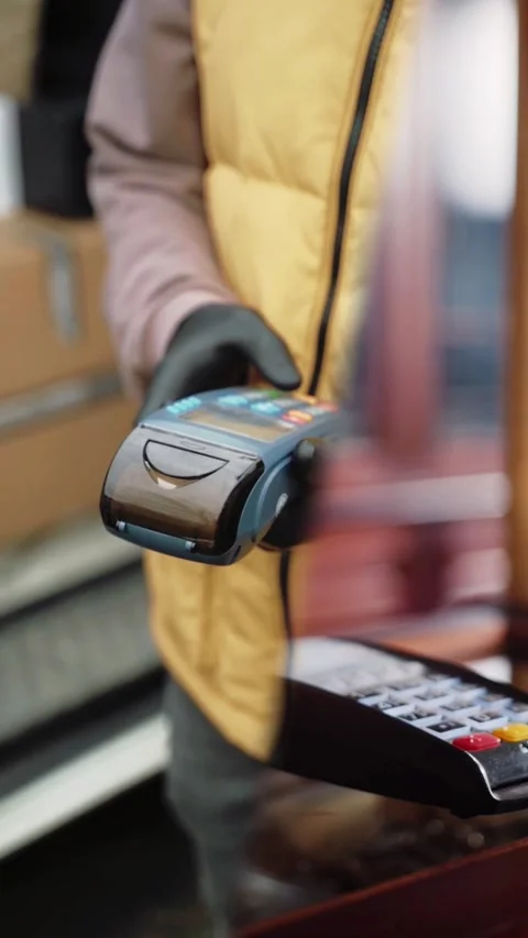 Contactless Payment at Retail Store: Hand Holding Credit Card Over POS Terminal Stock Footage 277093285