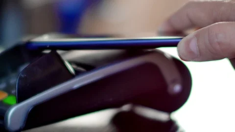 Contactless payment with smartphone with NFC technlogy. Stock Footage 97693196