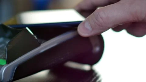 Contactless payment with smartphone with NFC technlogy. Stock Photos
