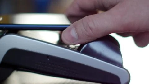 Contactless payment with smartphone with NFC technlogy. Stock Photos
