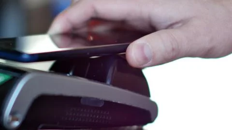 Contactless payment with smartphone with NFC technlogy. Stock Photos