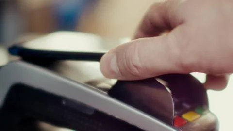 Contactless payment with smartphone with NFC technlogy. Stock Photos
