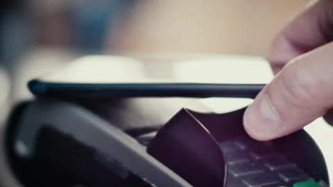 Contactless payment with smartphone with NFC technlogy. Stock Photos