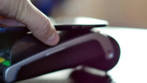 Contactless payment with smartphone with NFC technlogy. Stock Photos