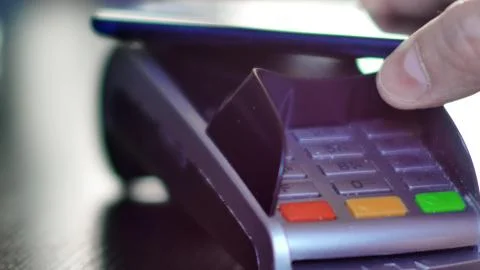 Contactless payment with smartphone with NFC technlogy. Stock Photos